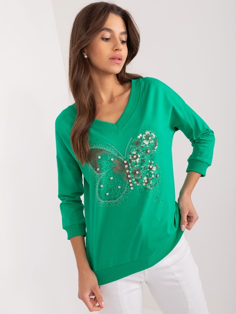 Green women’s blouse with appliqués