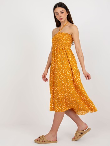 Yellow summer dress with polka dots tied around the neck