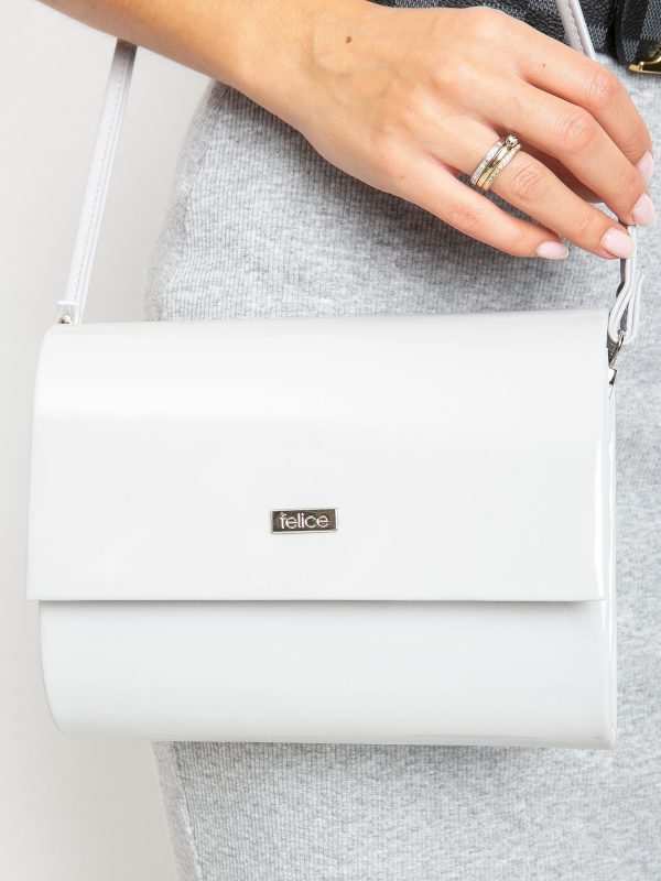 Light gray lacquered clutch bag