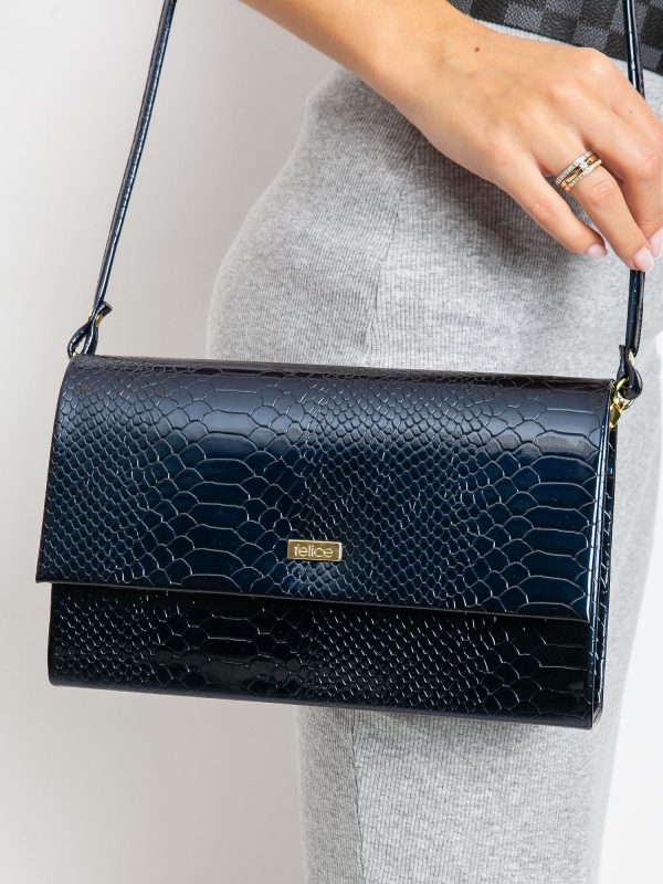 Navy blue lacquered clutch bag with snake skin motif