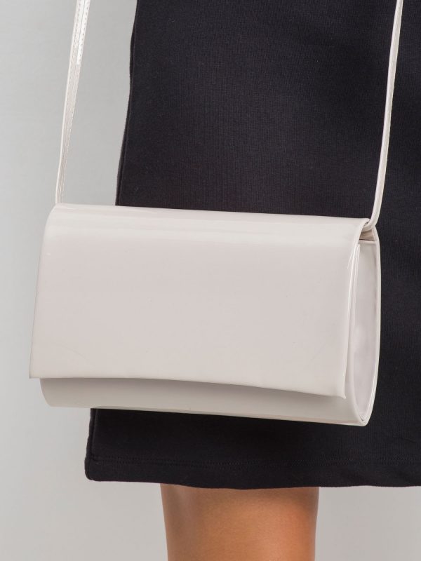 Light beige clutch bag made of patent leather