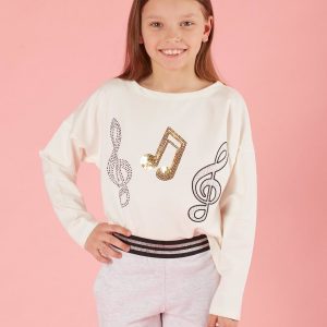 Ecru girl blouse with musical applique