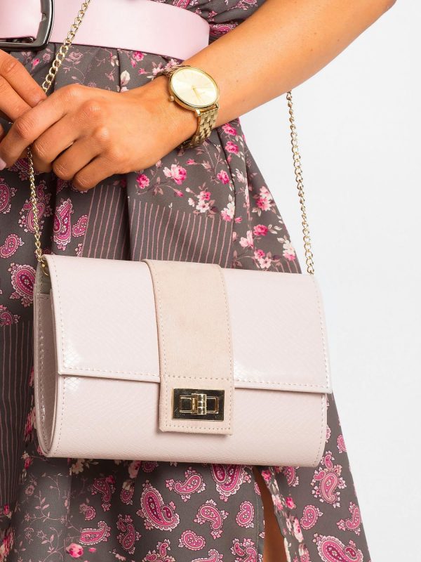 Light pink clutch bag on a chain