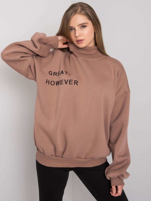 Kelly's light brown oversized sweatshirt