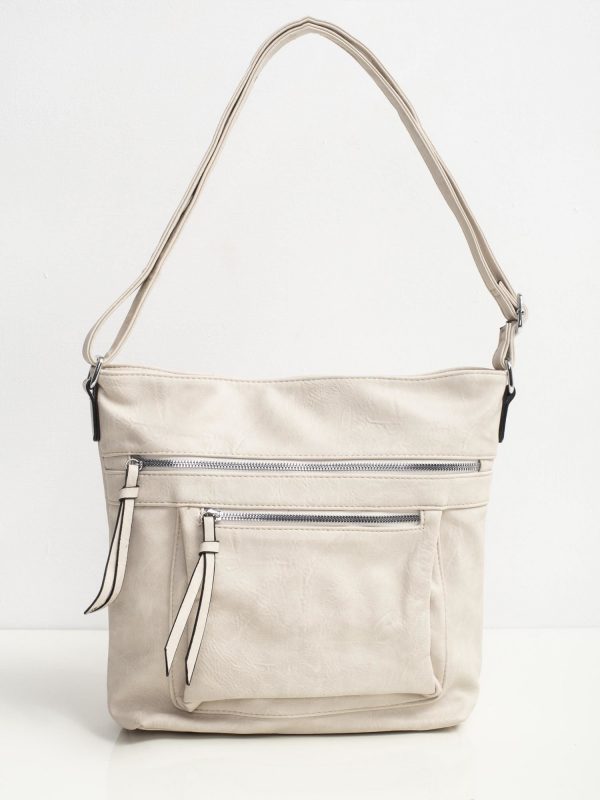 Cream bag with zippers