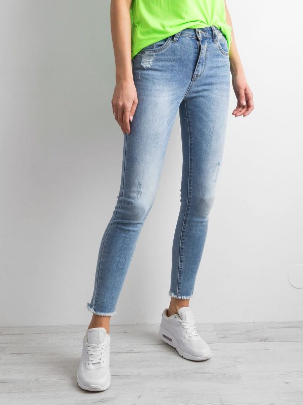 Blue denim pants with abrasions