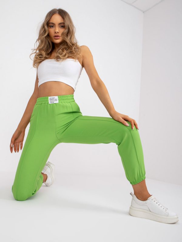 Light green women's pants with fabric without fastener