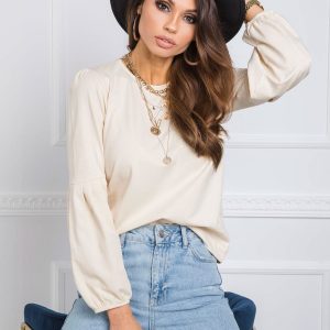 Kellie's beige blouse