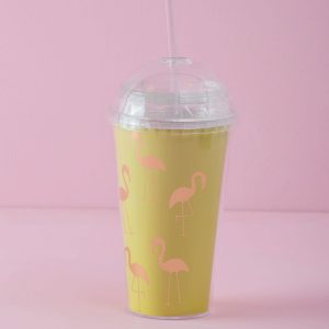 Yellow mug with lid and straw