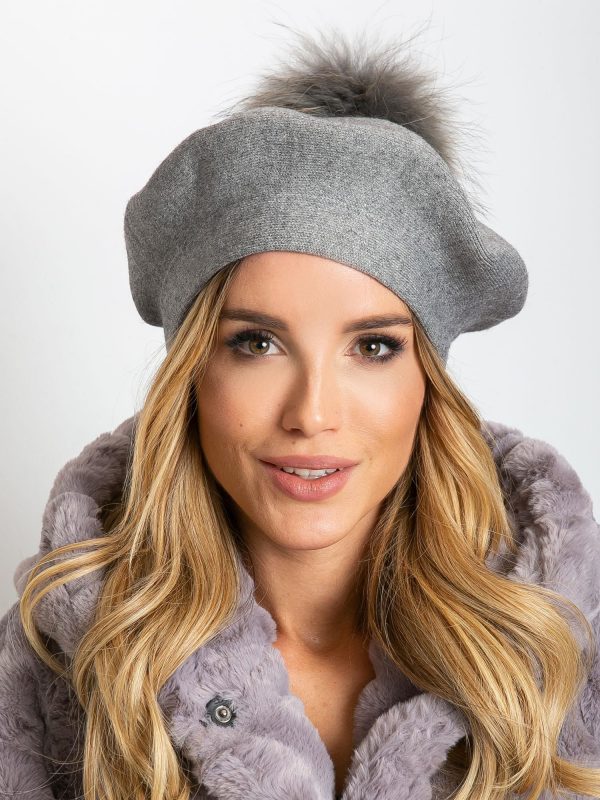 Gray knitted beret with tassel