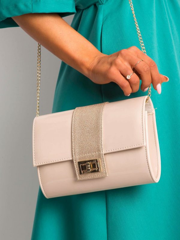 Beige clutch bag on a chain