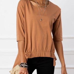 Lily's light brown blouse