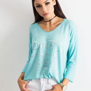 Turquoise V-neck blouse with inscription