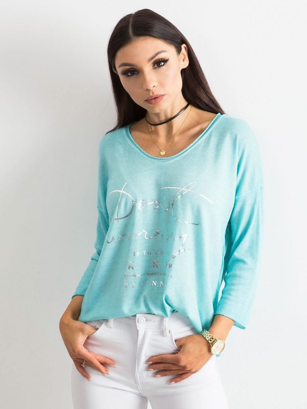 Turquoise V-neck blouse with inscription