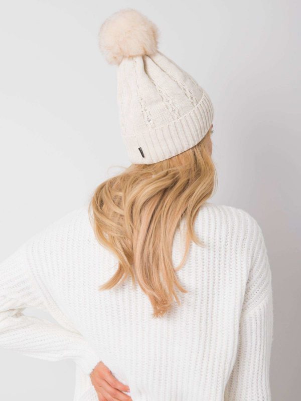 Light beige cap with appliqués