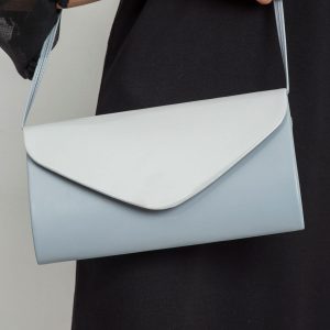 Light gray clutch bag with lacquered flip