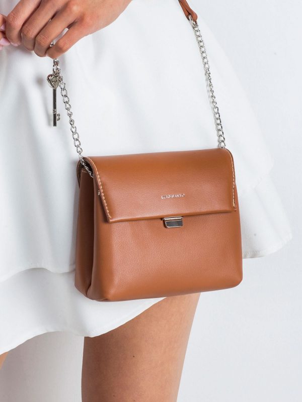 Brown handbag with pendant