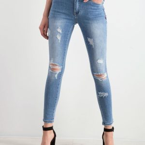 Blue denim pants with holes