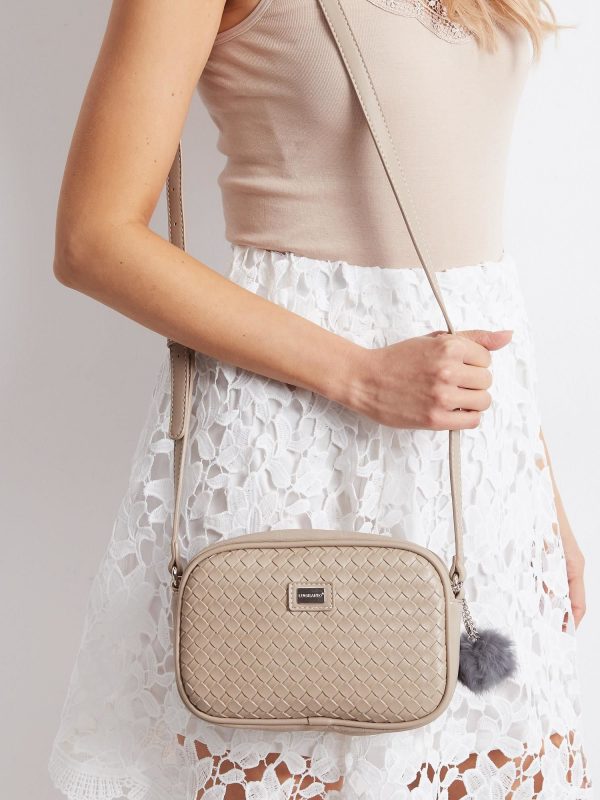 Beige postbag with braid and pompom