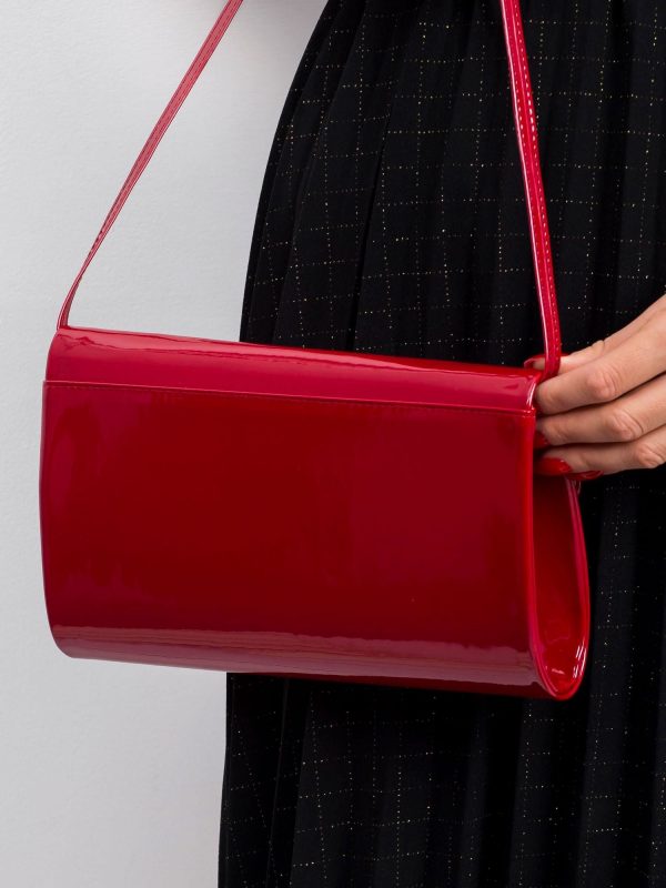 Dark red lacquered clutch bag