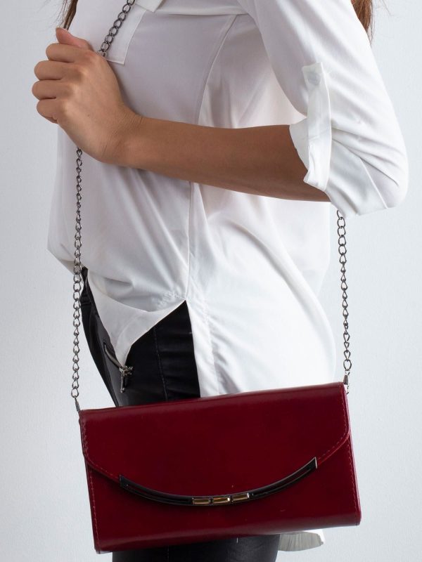 Burgundy clutch bag on a chain