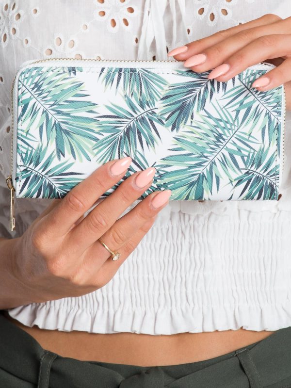 White-green wallet in leaves