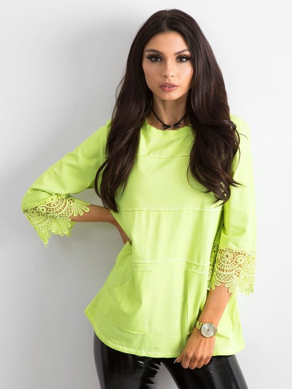 Light green blouse with lace and pockets