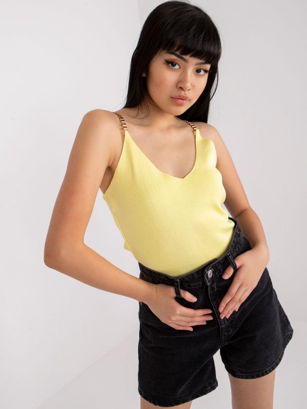 Yellow top with decorative straps