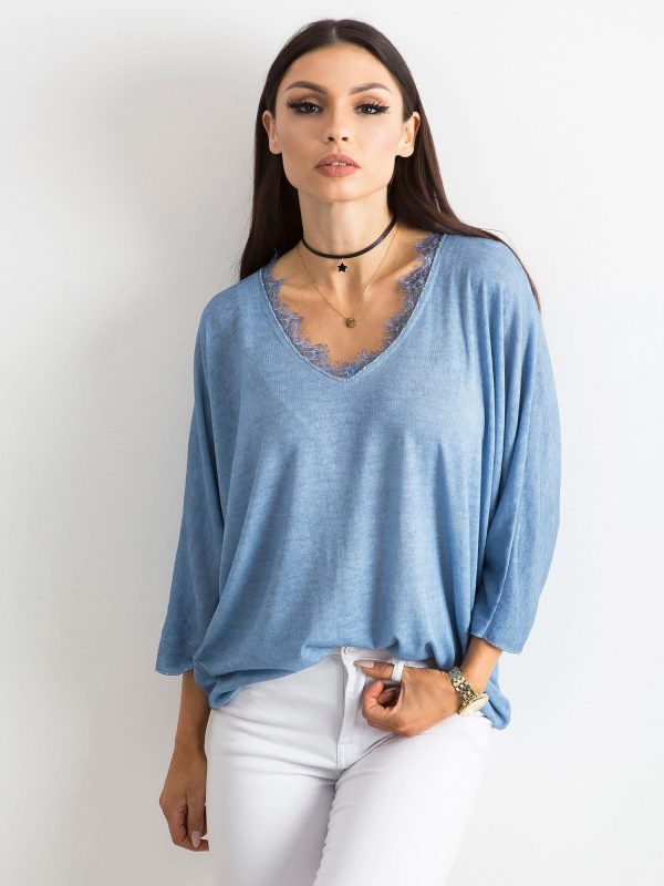 Light blue blouse with lace at the neckline