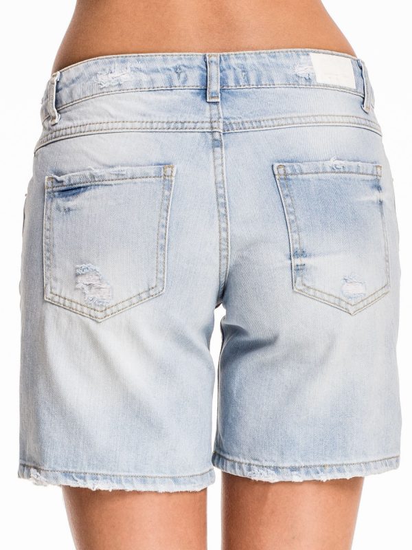 Blue denim shorts with abrasions