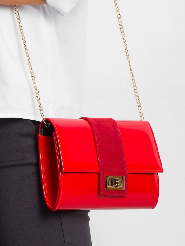 Red clutch bag on chain