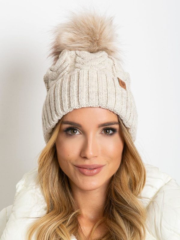 Beige insulated hat with tassel