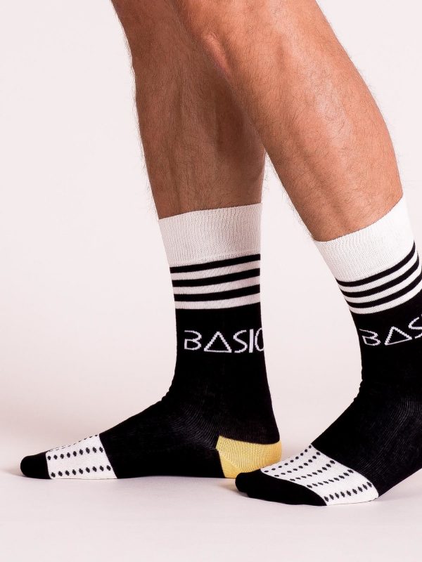 Black and ecru men's socks with patterns