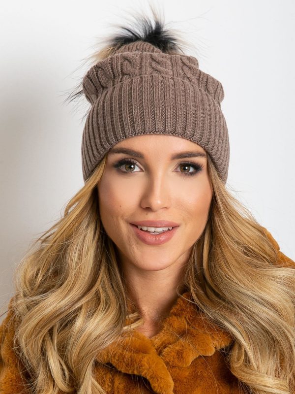 Dark beige hat with ribbing and fur pompom