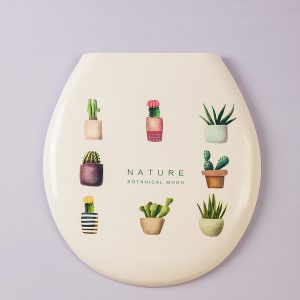 White toilet seat with plant motif