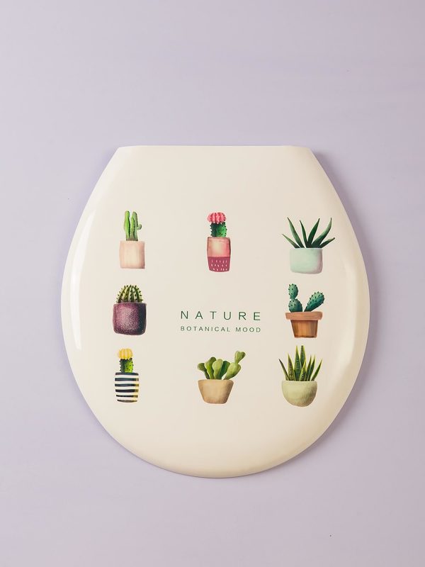 White toilet seat with plant motif