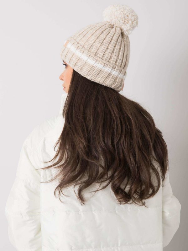 Beige hat with pompom