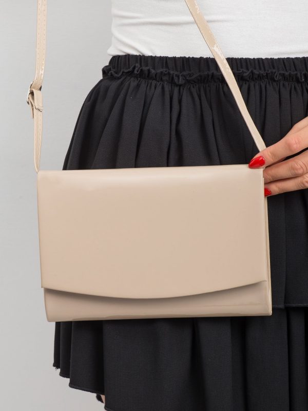 Small beige clutch bag