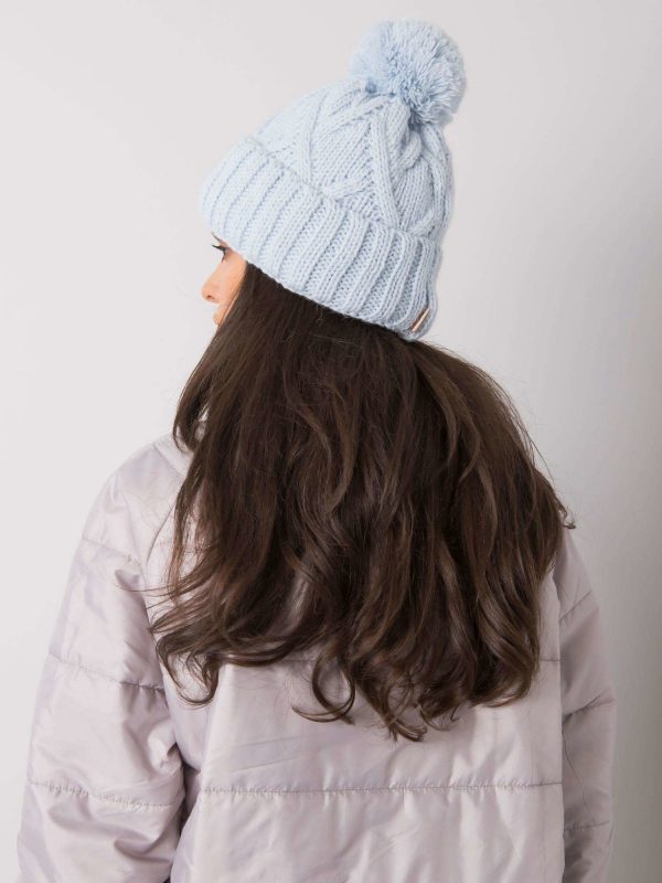 Light blue winter hat with pompom