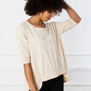 Lily's light beige blouse