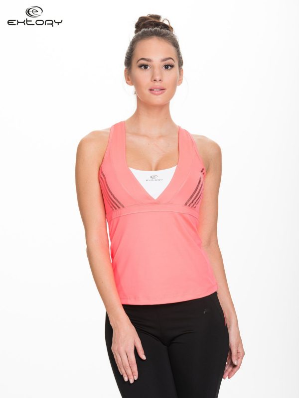 Fluocoral sports top with crisscrossed shoulder straps on the back