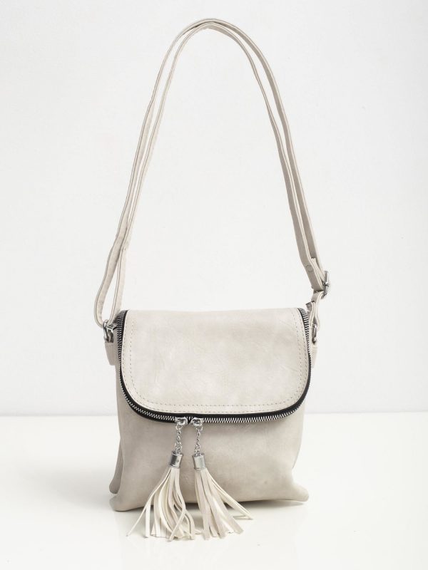 Light gray handbag with tasses