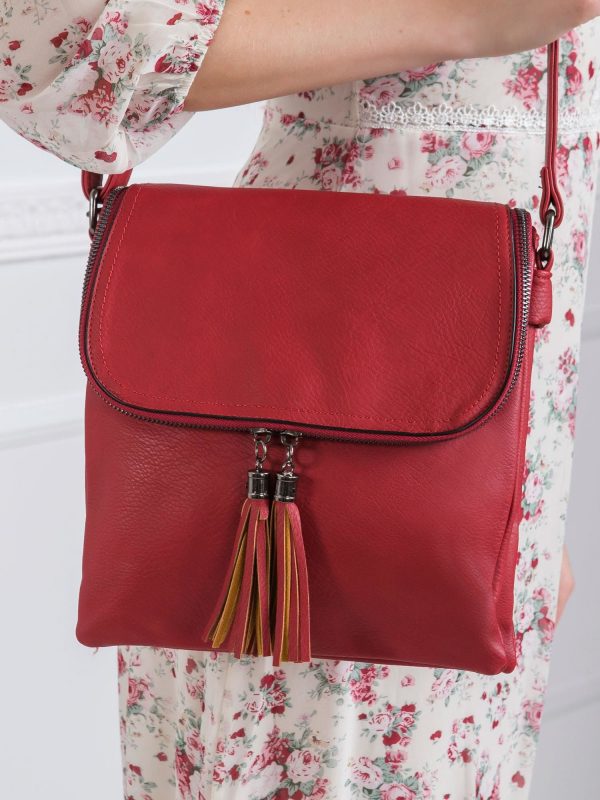 Dark red tasseled handbag