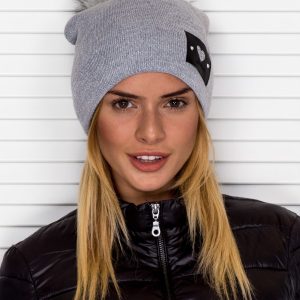 Wholesale Beanie hat with pompom and heart patch grey