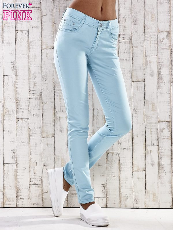 Wholesale Turquoise skinny jeans pants with embellishments at the pockets