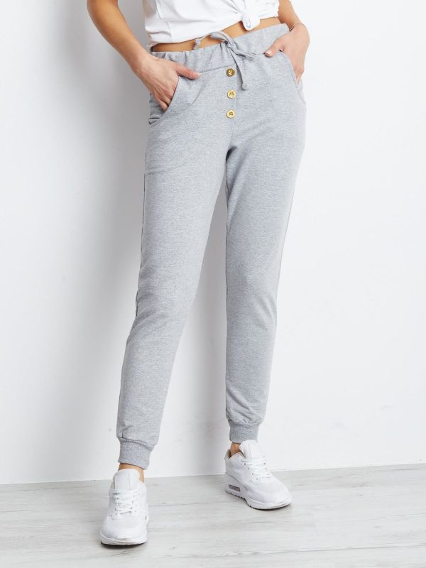 Wholesale Light grey sweatpants with gold buttons