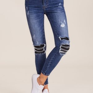 Wholesale Blue denim pants with zippers and holes