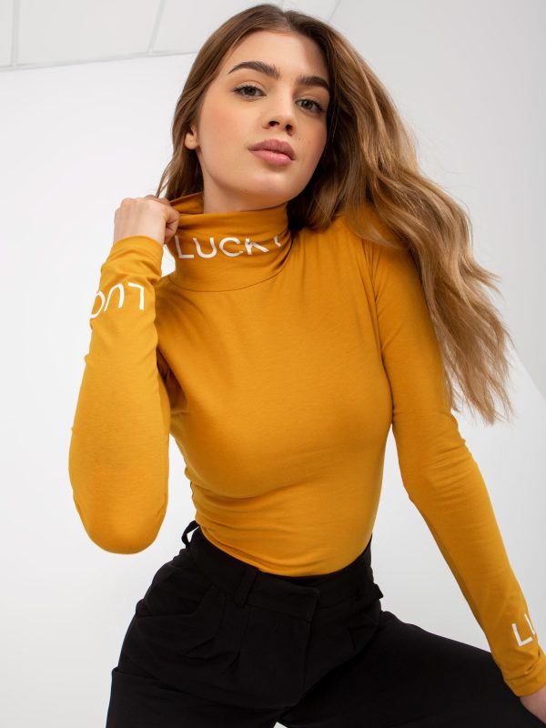 Wholesale Dark yellow fitted blouse with turtleneck and Fadila inscriptions